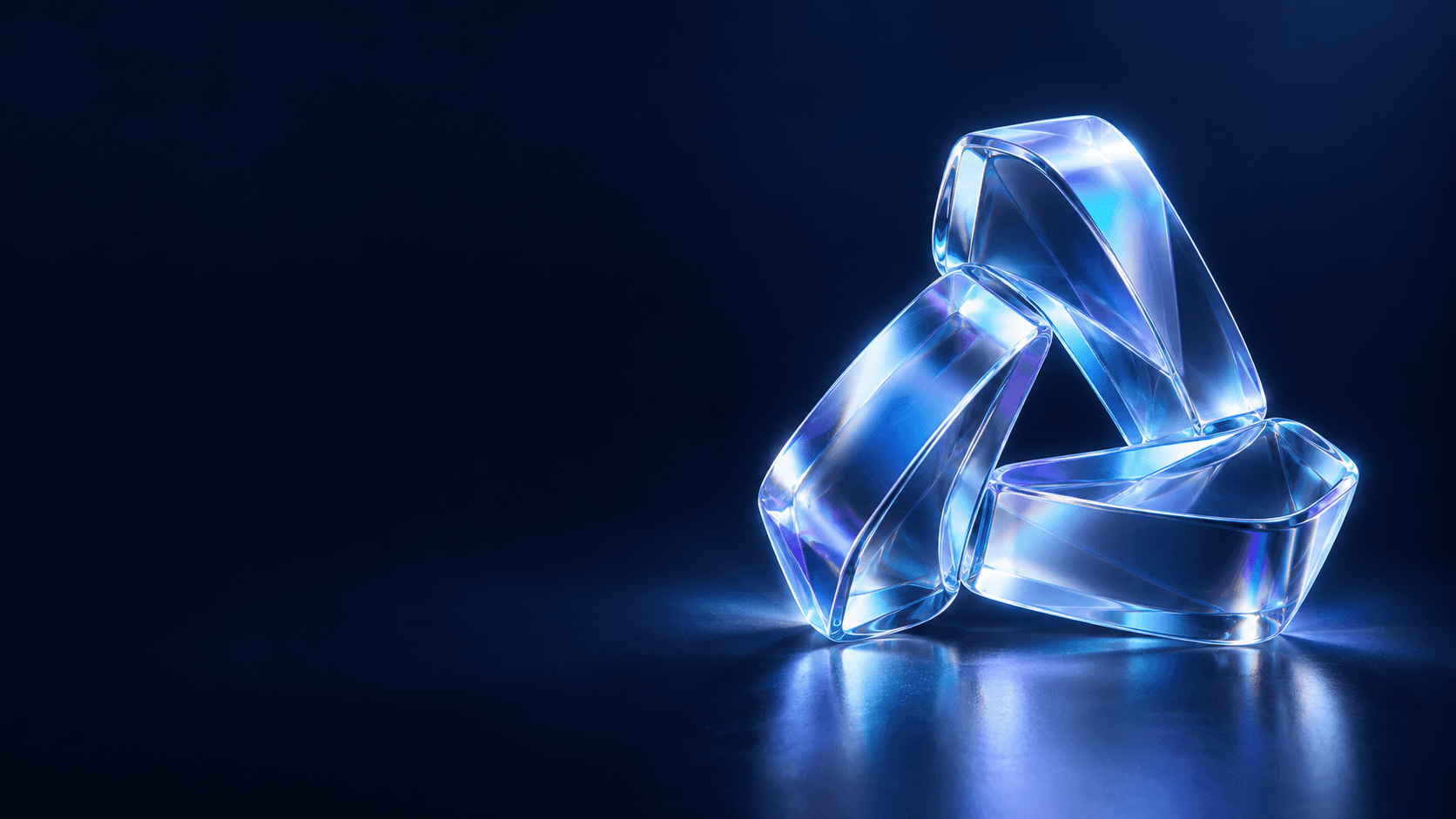 Three luminous glass forms assembled into a prism